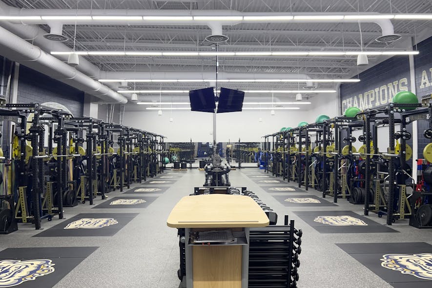 Kenall Manufacturing&apos;s Millenium Stretch germicidal LED luminaires both illuminate and clean the weight room of Chelsea High School, in Michigan.