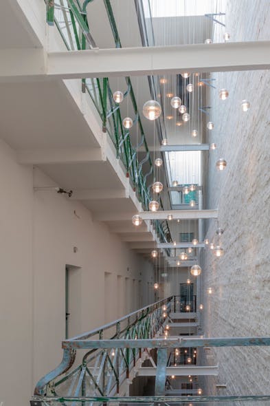 Bocci 14 series pendants suspend in the multistory lightwell.