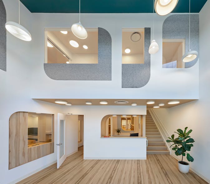 Variations in the size and shape of the luminaires and openings in this space create a sense of wonder and intrigue