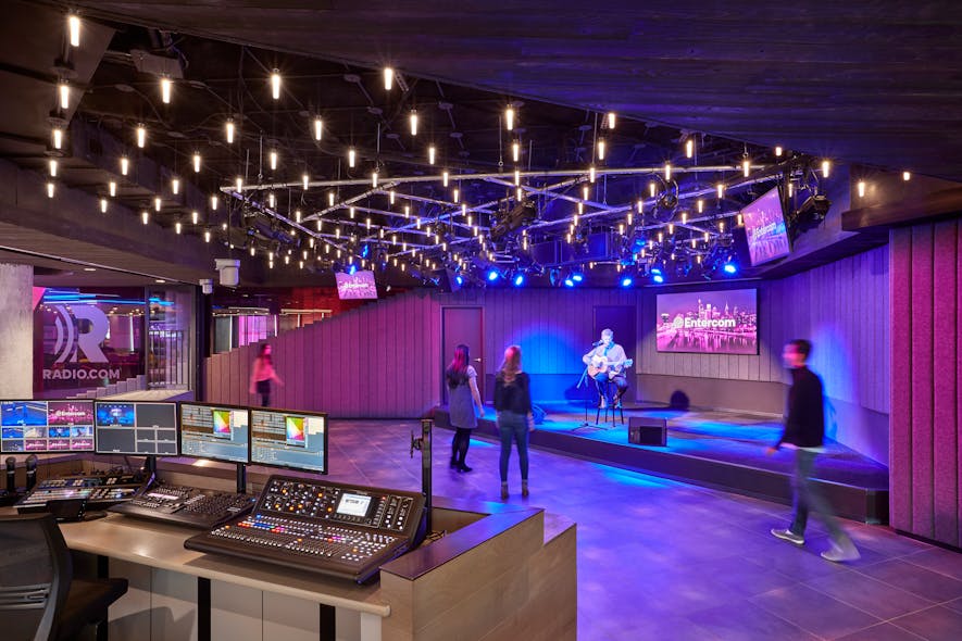 Suspended light tubes are programmed to twinkle randomly, similar to handheld lighters at live performances.