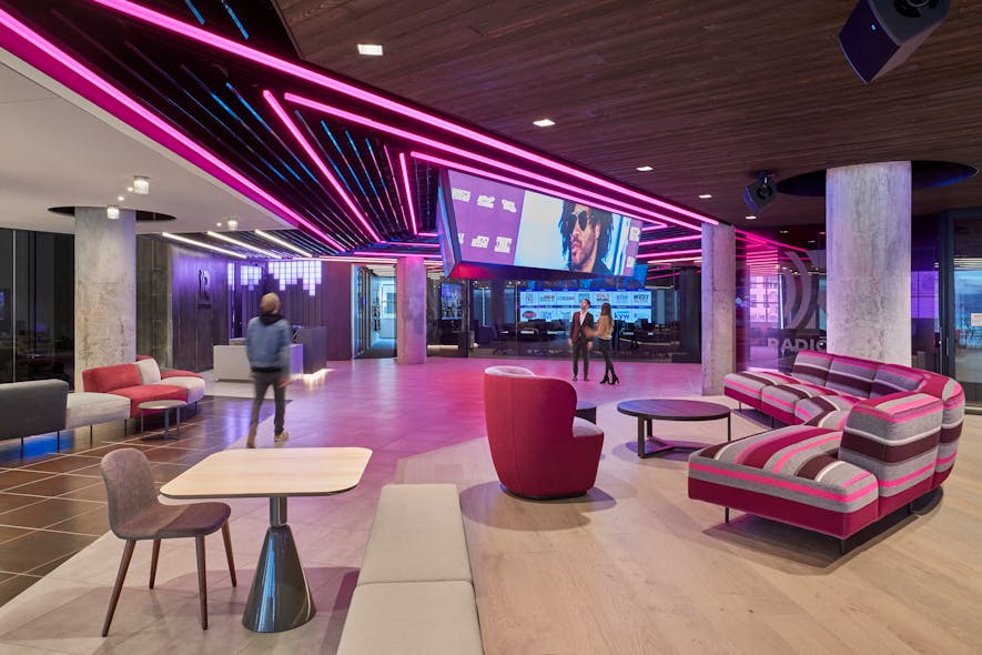 Large-scale monitors define a radiating diamond icon for dynamic color changing lines and high gloss ceiling fins at the central nexus.